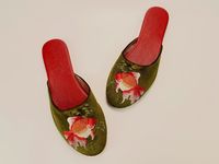 It is exotic whilst playful design with embroidery of Goldfish.  These embroidered velvet mules can be luxury slippers, wedding slippers, bridal shower gifts, bridesmaid gifts, wedding flats or a special gift for her.  Almond toe with padded soles for adding comfort.  They are crafted from butter-soft leather lining and insole. Outsole is leather in soft brushed finish.  Narrow fit with low heel for extra elegance.  You can pair with your favorite jeans for a stroll on Sunday farmer's market, or