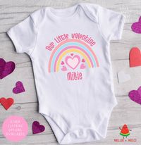 This personalised rainbow heart Babygrow is a lovely way to celebrate your little one's First Valentines Day with Daddy. Featuring a watercolour rainbow this is personalised with your little ones name and  is also avalible in a matching t shirts for older siblings too! INSTRUCTIONS: Choose your garment options and then simply enter the names as you want them to appear in the text box eg. Mia & Daddy, Mummy & Maya Available in a bodysuit (long sleeve or short sleeve), T-Shirt or Baby Grow. Printed directly onto the luxuriously soft garment, in 100% cotton, for a smooth classy finish. Please refer to images for size measurements. CARE INSTRUCTIONS This garment is delicately finished by hand so please wash inside out on a cool wash and hang to dry. Please do not iron directly onto the image P