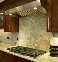 granite backsplash ,like the color of the cabinets