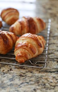 baked croissants on cooling rack