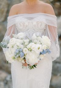 Lush garden style bridal bouquet of white and soft blue. bouquet by SOULFLORA at Wequassett Resort.