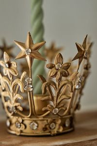 Found only at terrain, this celestial crown-shaped taper holder makes adds a regal and elegant touch to holiday decor.