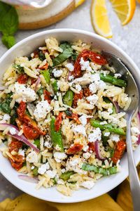 Loaded with sautéed asparagus, sun dried tomatoes, fresh basil & feta cheese all tossed in a vibrant lemon vinaigrette - this asparagus orzo salad has the most amazing flavor! It comes together quickly & makes a perfect side dish for Spring or Summer!