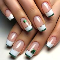 These french tip gel acrylic St. Patrick's Day Shamrock Nails are the perfect way to show off your festive spirit this holiday. The green and gold color palette, along with the iconic shamrock design, will make these nails stand out in a sea of traditional St. Patrick's Day colors. We believe in celebrating every occasion with style and creativity. That's why we have gathered some of our favorite nail designs for St. Patrick's Day that will help you elevate your look and add a touch of luck to your ensemble. First up, the french tip gel acrylic St. Patrick's Day Shamrock Nails. These nails are the epitome of chic and fun, combining two classic nail techniques - french tips and gel polish - with a festive twist. The green ombré effect on