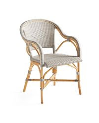 French sophistication — that certain *je ne sais quoi*. Inspired by the iconic silhouette of the Parisian bistro chair, each rattan frame is bent and shaped by hand. It bears marks of distinction — from harvest, an artisan touch, and nature’s material maturing in time. The beauty of incongruity.