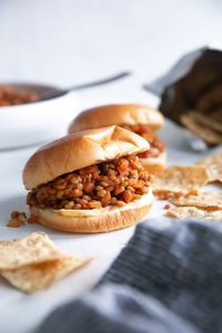 Sloppy and delicious, these Vegetarian Lentil Sloppy Joes are made using pantry essentials including meaty lentils and a tangy tomato sauce. Easy to make, freezer-friendly, and ready in just 30 minutes, serve this lentil sloppy joe recipe sandwiched between a toasted bun.