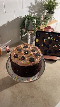 This soot sprite cake is inspired by the candy-loving soot sprites from Studio Ghibli's Spirited Away film. It's a simple, rich and delicious chocolate cake with a silky chocolate buttercream frosting. It's decorated with mini oreo "soot sprites" and rainbow star sprinkles.