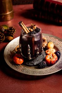 This Hocus Pocus-inspired drink, The Black Flame candle, is the perfect Halloween cocktail to celebrate the spooky season! It's made with blackberries, spices, Mezcal, and sparking water for a smokey, sweet, and spicey crowd-pleasing cocktail that the Sanderson Sisters would love!