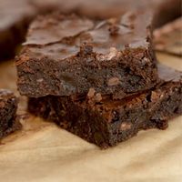 Mary Berry Brownies are a classic British dessert, characterized by their fudgy texture and intense chocolate flavor