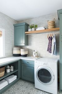 A new classic laundry room remodel with clay tiles, green cabinets, and patterned tile flooring | Studio McGee Blog