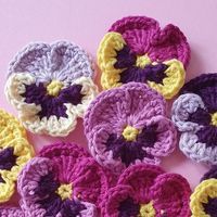 Crochet Pansies bring the delicate charm of pansy flowers to life in crochet, perfect for adding a floral touch to any project!