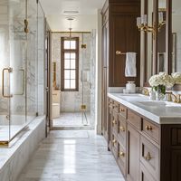 Step into this stunning master bathroom, complete with elegant marble flooring, custom wood cabinetry, and brass accents for a truly timeless design. Join our private Facebook group, 'Hack My Home: Luxury Design Styles,' to explore more inspiring ideas and connect with like-minded designers. #LuxuryBathroom #TimelessDesign #JoinOurCommunity