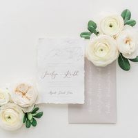 Romantic and simple wedding invitation on handmade paper featuring pencil sketch flowers! This invitation looks stunning with light grey envelopes and white calligraphy ink.