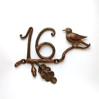 Floral outdoor decor, custom house metal sign numbers on oak branch with bird and acorn.  Bring a touch of nature and elegance to your home with our unique wrought iron house number.   Each digit is meticulously stylized to mimic the texture of the branch, creating a seamless and harmonious look. This attention to detail ensures that your house number not only serves its purpose but also becomes an eye-catching decorative element. Made with love and passion by our skilled artisans, this handcrafted house number is a testament to the timeless beauty of wrought iron craftsmanship. It will effortlessly elevate the curb appeal of your home and make a lasting impression on your guests. Height of number - 5 inches. Each number is handmade and unique The branch has two holes for attaching to the