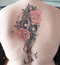 Explore 91 beautiful spine tattoos that make the pain worth it, showcasing stunning designs along the backbone.