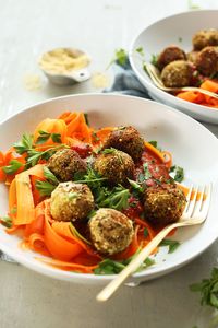 Our lentil meatball recipe served over carrot noodles with marinara for a healthy plant-based meal