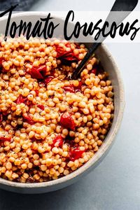 Israeli couscous with tomatoes is a delicious side dish. Pearl couscous tossed with burst cherry tomatoes & topped with a crispy garlic & shallot, chile oil. // recipes // side dish // how to cook // vegetarian