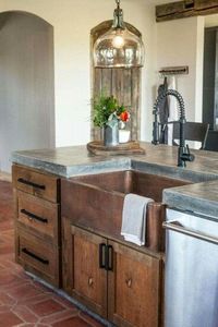 Love the concrete countertops, copper farmhouse sink, and rustic woods: