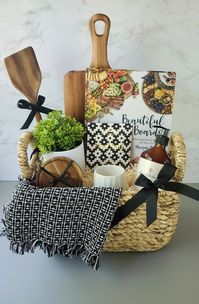 Celebrate the joy of a new home with our thoughtfully curated housewarming gift basket. Overflowing with warmth and charm, it holds delightful treasures to adorn every corner. From a scented candle that delights the senses to elegant kitchen essentials, this gift is a perfect gesture of love and well wishes for a happy home. #newhomeowner #housewarminggifts #giftbasketideas