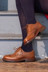 Our iconic Women's brogue boots encompass a timeless fusion of classic design and contemporary style. Handcrafted with precision and care, these boots feature exquisite brogue detailing that adds a touch of sophistication.  Whether you're navigating city streets or countryside trails, our brogue boots are the perfect combination of ruggedness and refinement, making them a versatile addition to any collection.