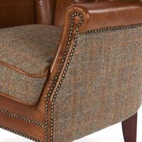 The Marlon Low Club Chair Brown Cerato & Gamekeeper Thorn Harris Tweed will add a premium touch to your living room. Estimated delivery within 10 weeks £19.00 UK Mainland One Man Delivery PRODUCT DETAILS H: 82cm x W: 75cm x D: 70cm Aniline Italian Leather and Harris Tweed Order A Free Leather Fabric Swatch With a sturdy hardwood frame and top quality aniline Italian leather and gamekeeper thorn tweed upholstery, this chair is the combination of great design and expert craftsmanship. With its