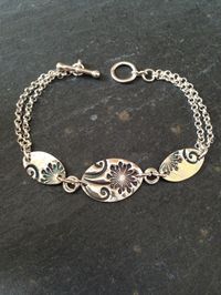 Dandelion and swirl triple link silver bracelet