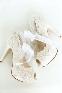 Beautiful lace bridal shoes in white. Sign up at http://bit.ly/RedefiningElegance for more wedding inspiration