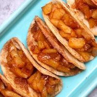 Super Easy Baked Apple Pie Tacos – delicious cinnamon sugary apple filling in a crispy and sweet taco, drizzled with caramel sauce, and then topped with whipped cream! The easiest dessert that comes together in no time. All you need is a few simple ingredients: Flour Tortillas, butter, cinnamon, sugar, apples, lemon, caramel sauce and whipped cream. It’s the perfect way to serve apple pie to a crowd! Quick and easy recipe!