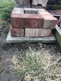 Looking to fill in an odd corner, lift up you planters or just want to liven up your outdoor patio? Here’s a simple and eye catching DIY! If you’re like me and have several brick around from patios, you can salvage what you have and create something perfect for your outdoor space. Salvaging old brick or buying new brick pavers I had quite a bit of left over brick from an old patio that was dug up. You can use salvage brick or buy new brick pavers from a store. If you get the standard…