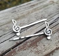 Music Note Bobby Hair PinsTreble clef bobby pins that will be music to your hair!  1 pair of totally cute G note hair pins to rock pixie cuts, scene hair, or pinning back pesky bangs. Music notes never looked so cute.You will receive 2 pins total.See my other listings for more quantities.