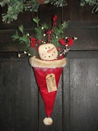 Use a santa hat to make a great holiday door decoration...cute idea!