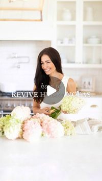 Fraîche Living : Tori Wesszer on Instagram: "My simple hack to revive wilted hydrangeas ✨ 

Hydrangeas are one of my absolute favourite flowers BUT they wilt SO easily... Here’s my little hack to bring your wilted hydrangeas back to life!

Materials You Will Need:
- Wilted hydrangeas
- Hot water (almost boiling)
- Vase
- Sharp knife
- Cutting board

Directions:
1. Bring a kettle or pot of water to a boil. Pour the water into a tempered glass vase or bottle (so it doesn’t crack). It doesn’t need to be full, just enough to cover a few inches of the stem.
2. Place the hydrangeas on the cutting board and use the sharp knife to cut the end of the hydrangea at a 45 degree angle. Then cut a small slit vertically up the middle of the newly trimmed stem.
3. Place the hydrangeas in the vase filled 