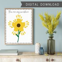 "Use this pretty You Are My Sunshine craft template to create a fun keepsake or present for friends and family. This sunflower handprint template lets your kid create flower petals with their hands. It's a perfect DIY craft for kids and babies. All you need to do is print the template, paint and stamp your kid's hand, and enjoy! It's the perfect handmade gift for birthdays, Mother's Day, or Father's Day. You will get an instant digital download of a digital file, and can print and finish the cra