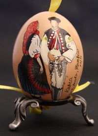 chicken egg with a delicate painting of a couple in traditional slovak costume