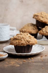 Cinnamon pear muffins - these easy vegan muffins are super soft, moist and fluffy with tall muffin tops, a sweet cinnamon flavour, chunks of juicy pear and a crisp streusel topping.

These are the perfect Autumn muffin and are great for snacking on!