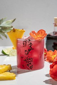 This Hibiscus Pineapple Margarita is the perfect tropical blend of fruity and floral for Spring and Summer parties.