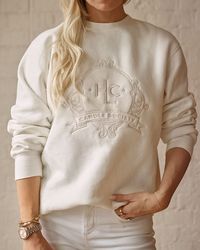 Introducing our Candle Society crewneck, the ultimate collector's item for the candle-obsessed. This limited edition, vintage-washed sweatshirt features the Candle Society crest embroidered across the chest, in a chic tone-on-tone colorway. Crewneck has a buttery soft, worn-in feel and runs true to size. For an oversized fit, the Concierge recommends choosing your true size. For a “standard fit,” size down. Lindsay is wearing size XS/S. Matt is wearing size L. Machine wash cold with like colors.