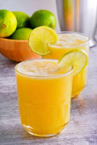 This thirst quenching Pineapple Mango Mocktail is a delicious taste of paradise! With just four ingredients, this tasty drink is incredibly refreshing with the perfect blend of sweet pineapple and juicy mango. It's an amazing flavor combination that is sure to have you dreaming of a tropical vacation! | MomOnTimeout.com