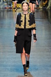 This Dolce & Gabbana cropped jacket is embellished with intricate details, adding a touch of luxury to your wardrobe. Expertly crafted and designed, the perfect combination style quality. Elevate any outfit statement piece.