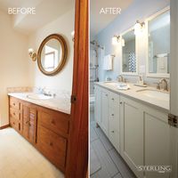 BEFORE: Rich cherry cabinets, trim, and accents paired with cream flooring and walls didn't exactly set the tone for a serene bathroom. AFTER: An updated color palette with soft blues and cool shades of white lends a relaxing and calming feel. With the wall removed, the bathroom is opened open, allowing for better flow, in addition to the larger and more functional vanity with room for two Stinson sinks. Two new mirrors, highlighted by glowing sconces, were also added.