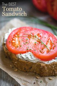 A blissful taste of summer! Use your very best tomato and a bakery-fresh, grainy loaf of bread to create delicious magic in just minutes! This fantastic Open-Faced Tomato Sandwich features a tangy slather of herbed cream cheese, and a sprinkling of coarse salt to make the sandwich come alive! Check out all our tips for an absolutely perfect tomato sandwich! | tomato recipes | heirloom tomatoes recipes | open faced sandwich | sandwich recipes | summer recipes | www.TwoHealthyKitchens.com