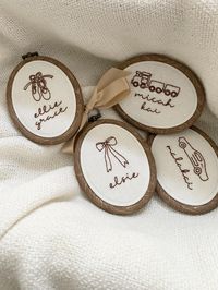 *Carefully hand embroidered ornaments/keepsakes *Size- 6cm x 7.5 cm  Hoop *perfect size to be used as stocking tags or simply use them as tree ornaments and what a perfect keepsake this will be.  *All names are embroidered in lower case letters. *Due to the size of the hoop, please limit your name choices to two names/words. *If you have any specific questions, please feel free to message me.