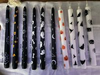 "Perfect candles for your spooky decor! This listing is for 1 hand painted tall, skinny, pillar/taper shaped candle with your choice of pattern. Each candle is hand painted so no two are exactly alike. Patterns available for candles are: -Bats -Candy Corn (best on black) -Celestial -Ghosts -Ouija Board theme -Pumpkins (with or without some jack-o-lantern faces) -Skulls & Bones -Spiders -Spider Webs -Witch Hats Patterns named in final picture. If you want want all of the pumpkins to have faces fe