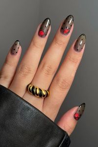 Celebrate the season of love with these chic black and red Valentine's Day nails and a statement-making Croissant Dome Enamel Ring. ✨ The combination of bold colors and elegant design make this a perfect choice for a special occasion or a night out on the town! 🥰 #valentinesdaynails #valentinesday #valentinesdaygifting #vdaynails #nailart #goldjewelry #fashioninspo