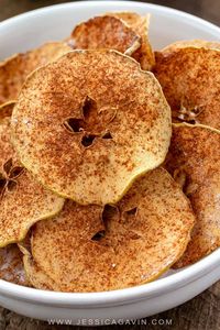 Baked apple chips are a healthy snack made with your favorite variety of apple. Cinnamon and a light dusting of powdered sugar enhance the flavor. #applechips #healthysnack #apples #snacks