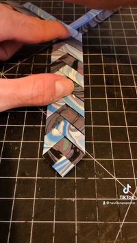 Watch how we make these elegant and fun woven bookmarks, folding together our original handmade marbled papers! Here we weave together two suminagashi marbled pattern made with blue and pink papers. Check out our marbled gifts on Etsy! #etsyshop #handmadebookmark #diybookmark #wovenbookmark #bookmarksdiy #diyprojects #bookmarks #bookmarklove #bookworms #booklovers #giftsforbookworms