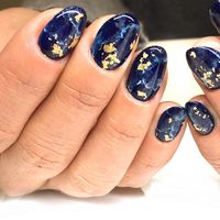 gorgeous deep blue marble nail art with gold flake accent nails. This manicure is very reminiscent of a Lapiz Lazuli rock! It's perfect for any season and will wow anyone. Click through for more nail art inspiration from Katie Masters aka Nail Thoughts