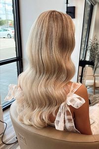 Check out gorgeous bridal hair ideas that wow. This re-pin offers soft waves featuring soft curls. Great for a glam style.