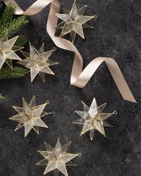 Add a beautiful, pearlescent glow to your holiday decorating. Elevate your Christmas tree with the natural elegance of capiz shell ornaments. | 5" Gold Star Capiz Ornament Set, Set of 6, Width 4.5 in by Balsam Hill