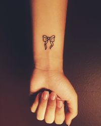 Small bow tattoo- cute wrist tattoo-